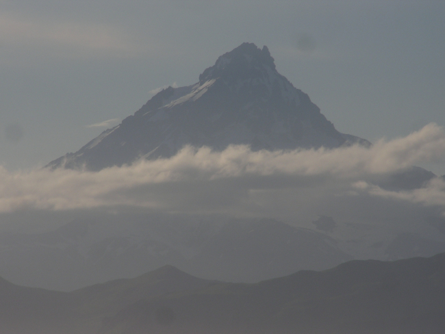 Isanotski Volcano, also known as Raggedy Jack seen on a misty day