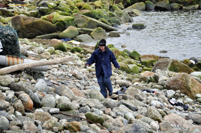 Officer off NOAA Ship FAIRWEATHER strolling on the Little Diomede beach