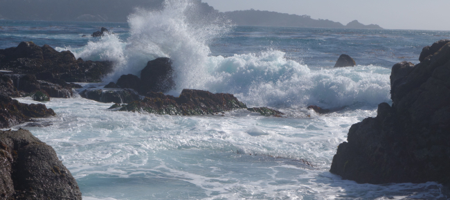Surf crashing on the rocks on the north side of Carmel Bay