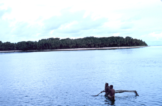 Natives visiting the TOWNSEND CROMWELL in outrigger canoe