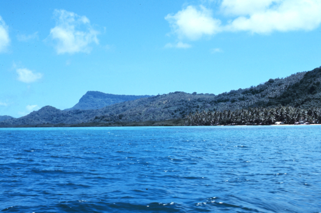 High volcanic island with fringing reef