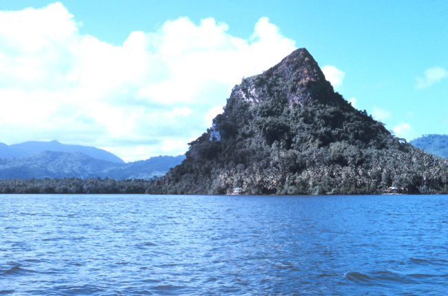 A conical hill adjacent to the sea