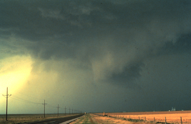 Thunderstorm out flow from storm core shows up as sheets of wind driven rainspreading from right to left in 1982 photo