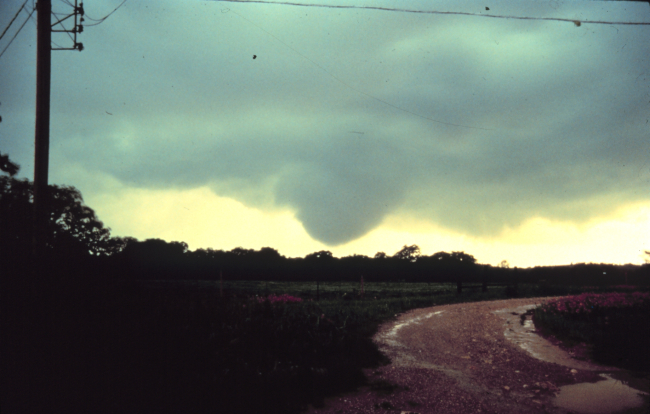 A funnel cloud approaching the ground