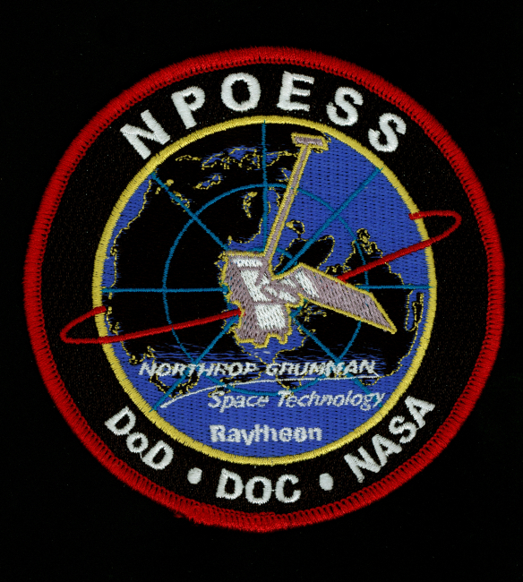 NPOESS patch showing polar orbiting satellite and DOD, DOC, NASA partnership