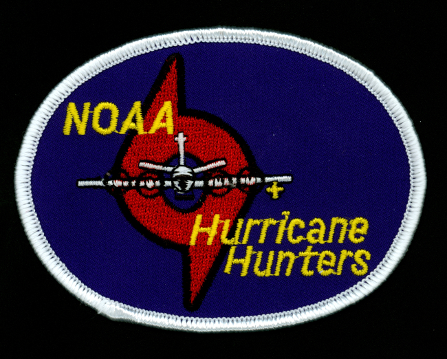 NOAA Hurricane Hunters patch signifying the NOAA mission to conduct researchin hurricanes and warn the public of potential hurricane hazards