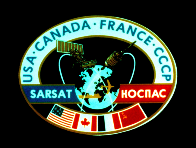 NOAA SARSAT patch signifying international cooperation between France, Canada,the United States, and the former Soviet Union