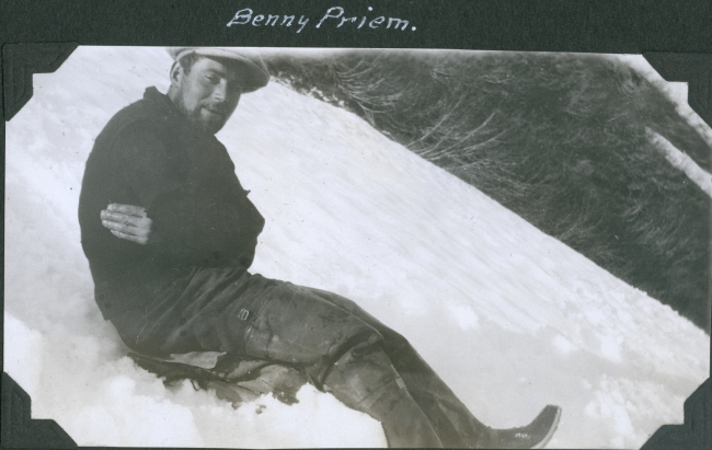 Benny Priem sliding down a mountain while returning from a shore party