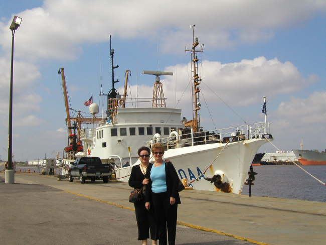 NOAA Central Library head cataloger Anna Fiolek and head of referenceDorothy Anderson in front of NOAA Ship OREGON II at Pascagoula, Mississippi