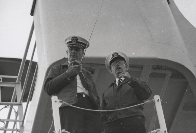 CDR James Randall with radio and CAPT Miller J