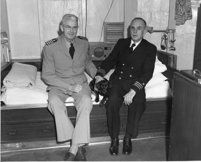 Captain George Anderson and Commander Walter Bainbridge in Captain's cabin ofCoast and Geodetic Survey Ship EXPLORER
