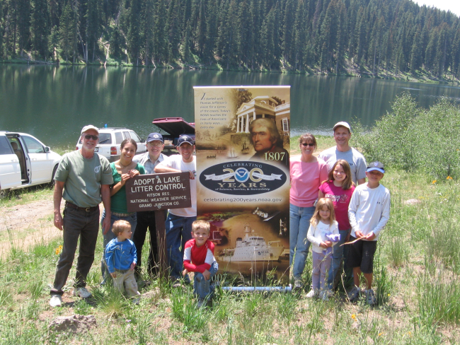 Personnel and family members from the National Weather Service Office in GrandJunction, Colorado participate in their annual Adopt a Lake clean up program, aservice they have participated in since 1992