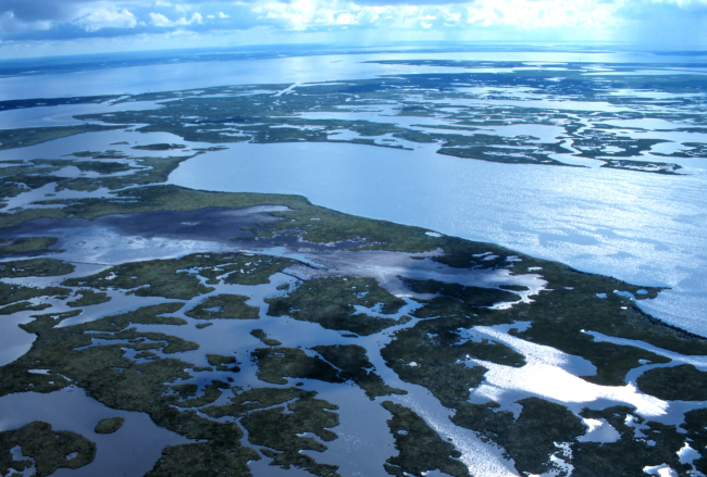 A clear aerial view of Lake Chapeau in the right of the image