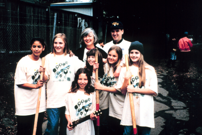 A group of student volunteers with Congresswoman Lynn Woolsey, a supporterof the restoration at Adobe Creek