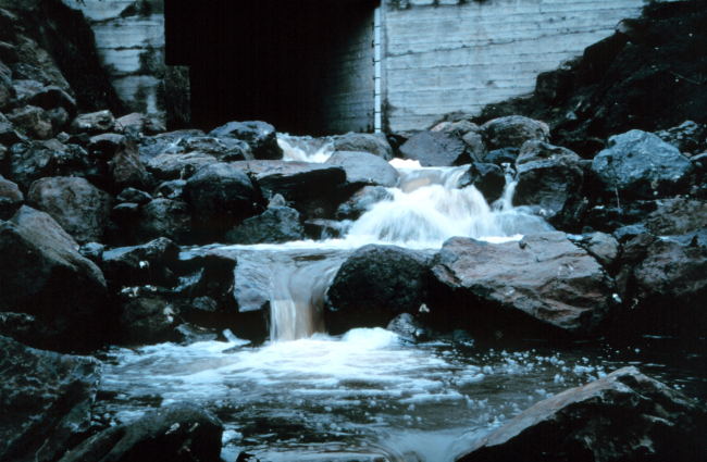Water flows downstream over the completed pools