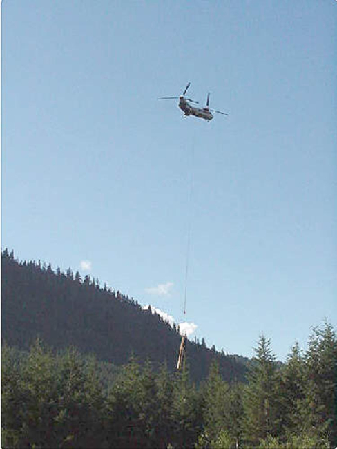 A Boeing Verto 107 helicopter was used to lift logs into place in the stream