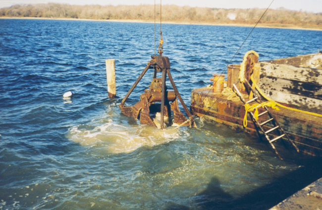 Lowering the reef materials into the water to constructthe reefs