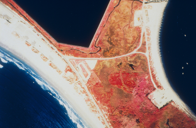 A color infrared aerial of Sachuest Marsh looking upstream and downstreamprior to restoration