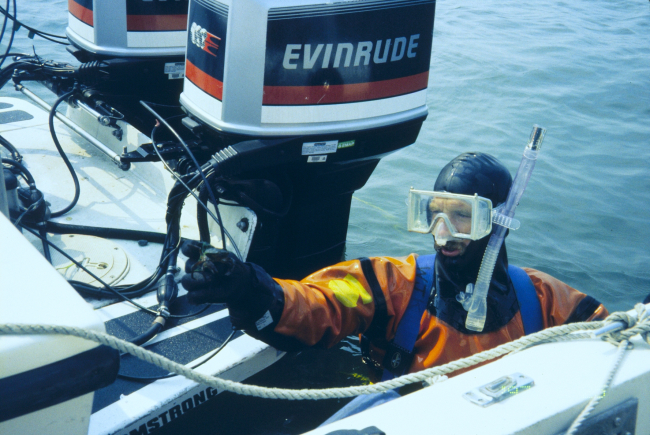 The sixth in a series of images showing NOAA scientists at the 1997 transplantsite just before transplanting the eelgrass turf