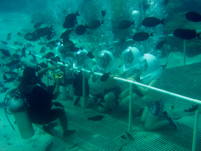 Tourists posing at a Guam reef attraction