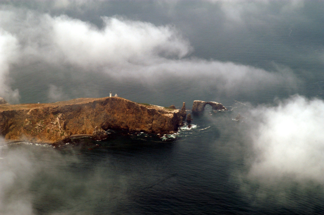 Anacapa Island and lighthouse through the clouds