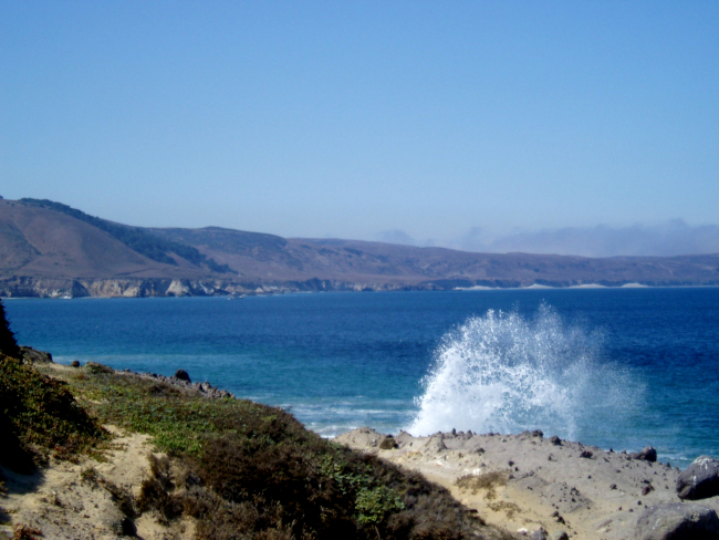 Waves crashing into Santa Rosa Island produce an arc of spray