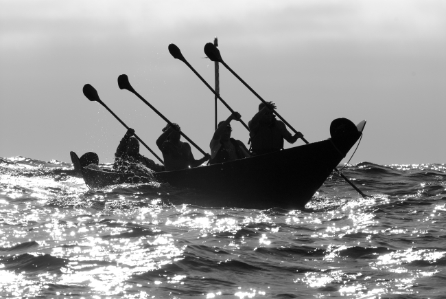 Chumash Tomol 'Elye'wun paddlers crossing at Santa Cruz Island