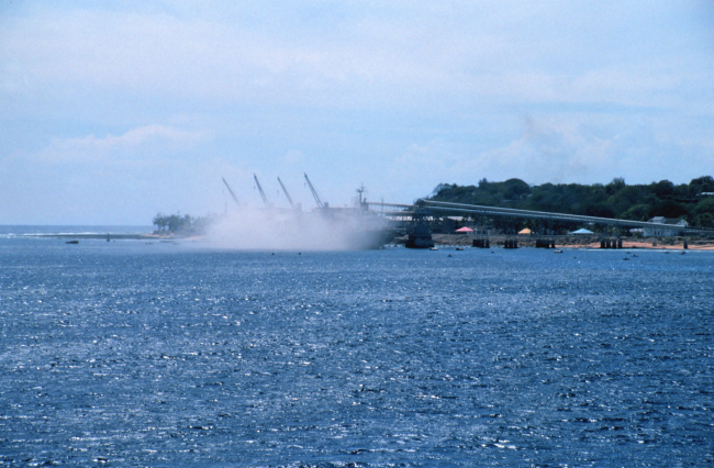 A view of filling a bulk carrier ship with phosphate at the piers at Nauru asseen from the NOAA Ship RONALD H
