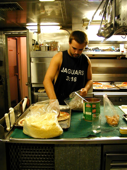 McARTHUR deck hand Mike Theberge preparing for Pizza Night at sea onthe NOAA Ship McARTHUR