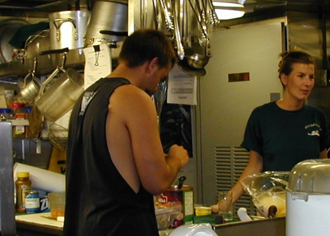 McARTHUR deck hand Mike Theberge and NOAA Corps Lieutenant Alexvon Saunder preparing pizzas on McARTHUR Pizza Night