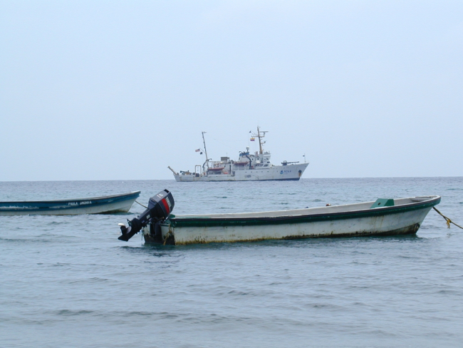 NOAA Ship McARTHUR offshore from native-owned pangas at Isla Gorgonaduring STAR 2000 project