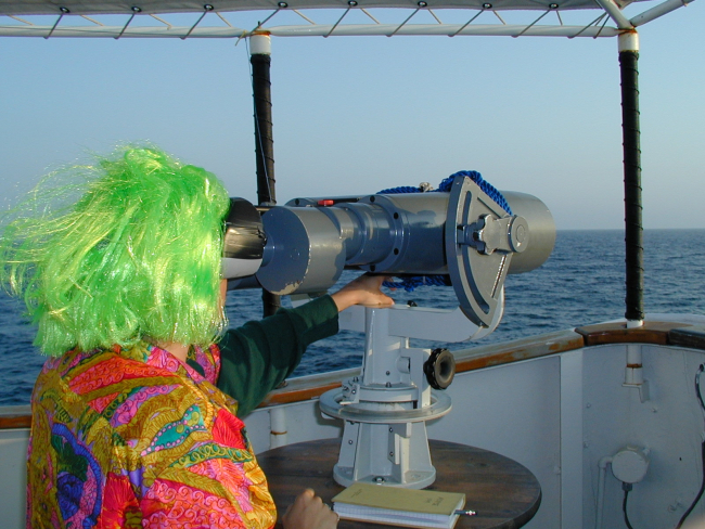 Laura Morse working on the Big Eyes searching for marine mammals onHalloween