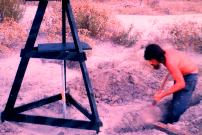 Seaman Jesse Byrd digging a hole to place batteries for Del Norte super-high-frequency navigation system