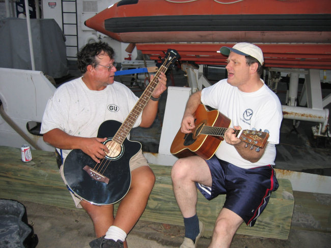 Peter Liewit and Chief Bos'n Wolf strumming away on the Gulfport Pier