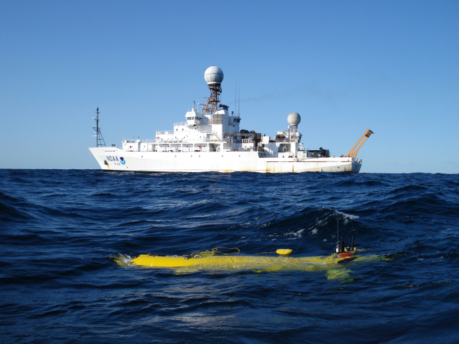 Autonomous underwater vehicle (AUV) in foreground
