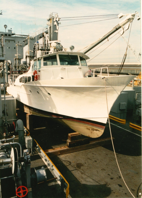 NOAA Launch 1257 cradled on the deck of USNS cargo ship prior totransport and transfer to government of Malta