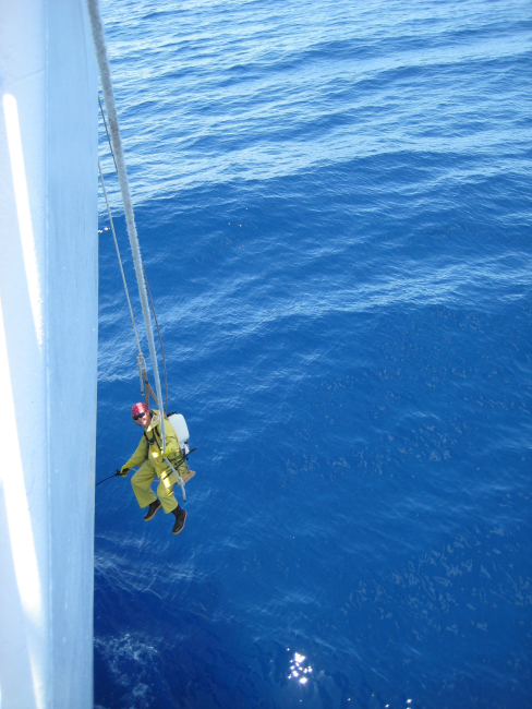 Touching up the bow of the NOAA Ship HI'IALAKAI
