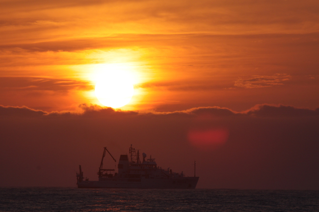 NOAA Ship PISCES silhouetted in the sunset