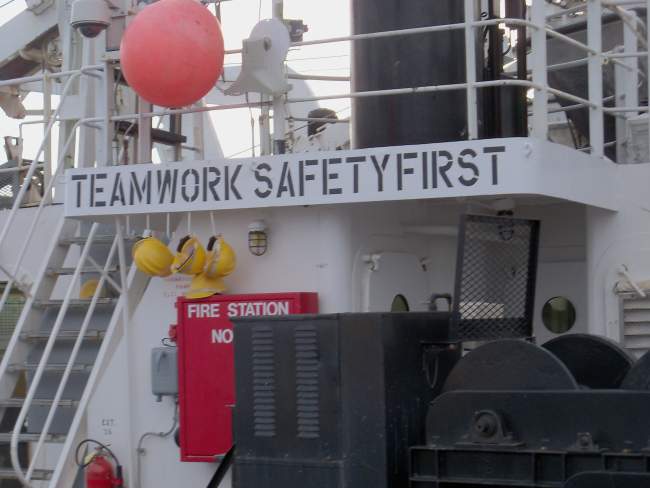 Sign on after deck of NOAA Ship RAINIER emphasizing teamwork andsafety first