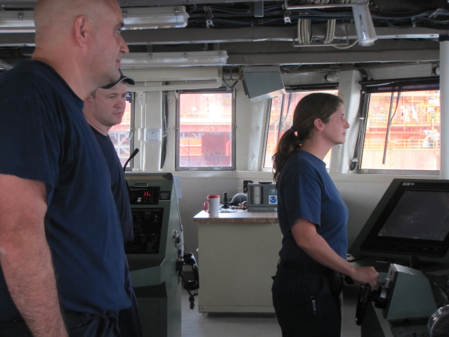 Commander Jeremy Adams on the left, commanding officer of the NOAA ShipPISCES, monitoring its transit through the many ships and other craft on-siteat the Deepwater Horizon disaster well relief effort