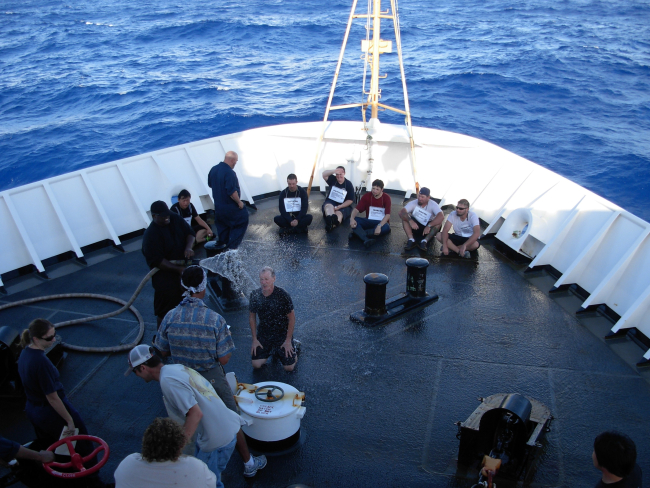 Pollywog being hosed down during equator crossing ceremonyNOAA Ship KA'IMIMOANA (R333)