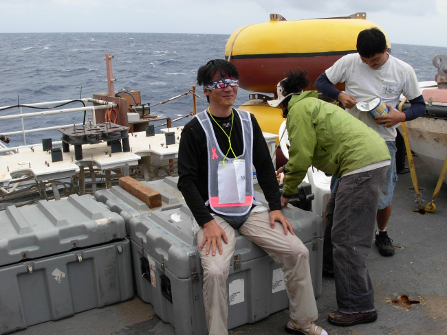 A pollywog during a trip to the royal barber during equator crossing ceremony on the NOAA Ship KA'IMIMOANA (R333)