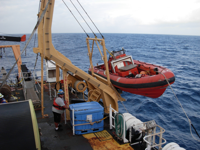 Preparing to launch rigid hull inflatable boat (RHIB) off of NOAA ShipKA'IMIMOANA (R333)