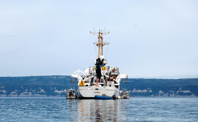 Stern view of NOAA Ship RAINIER with survey launches alongside