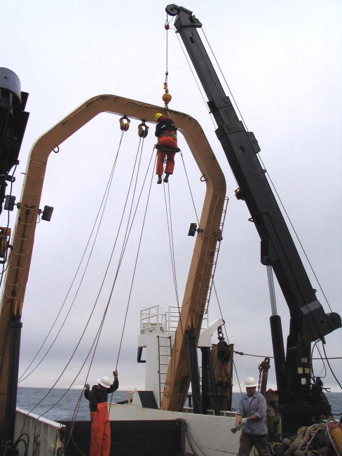 Performing maintenance on the running gear of the A-frame on the NOAA ShipMILLER FREEMAN