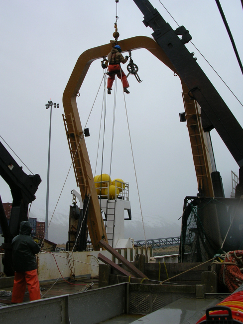 Performing maintenance on the running gear of the A-frame on the NOAA ShipMILLER FREEMAN