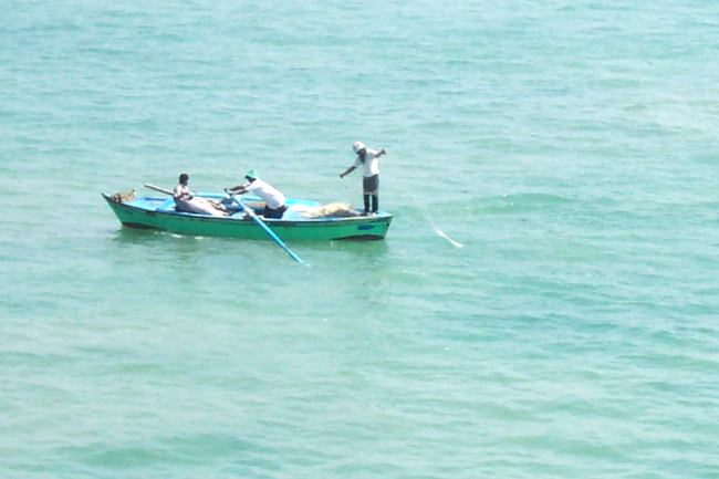 Egyptian fishermen in the Suez Canal