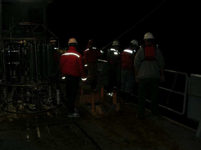 Camera flash reflecting off PFDs during deployment of towedacoustic multibeam array aboard R/V THOMAS G
