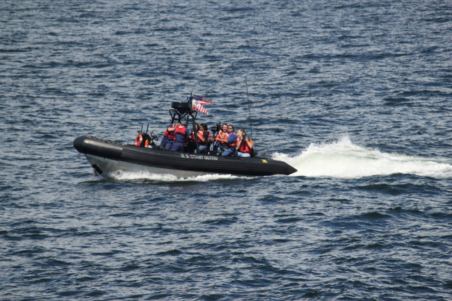 United States Coast Guard rigid-hull inflatable boat underway with passengers