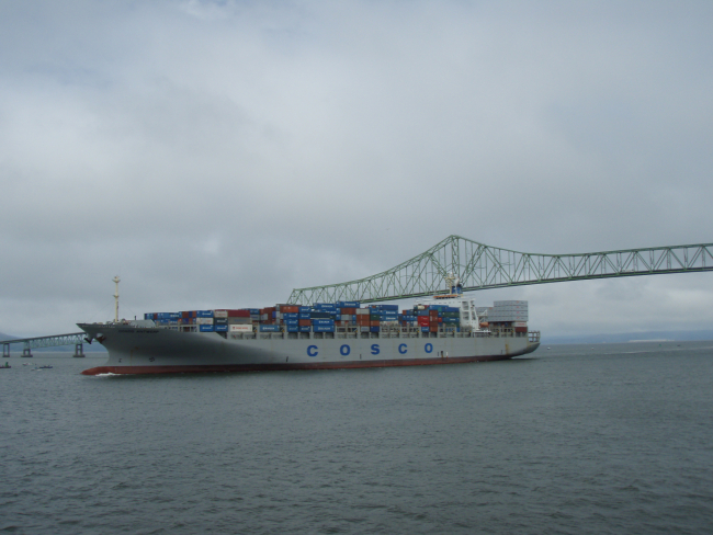 Cosco shipping lines COSCO ANTWERP  heading out of the Columbia Riverjust after passing under the Astoria Bridge